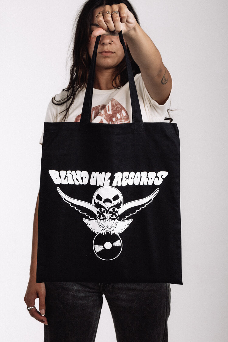 Black tote bag with Blind Owl Records owl and vinyl logo in white