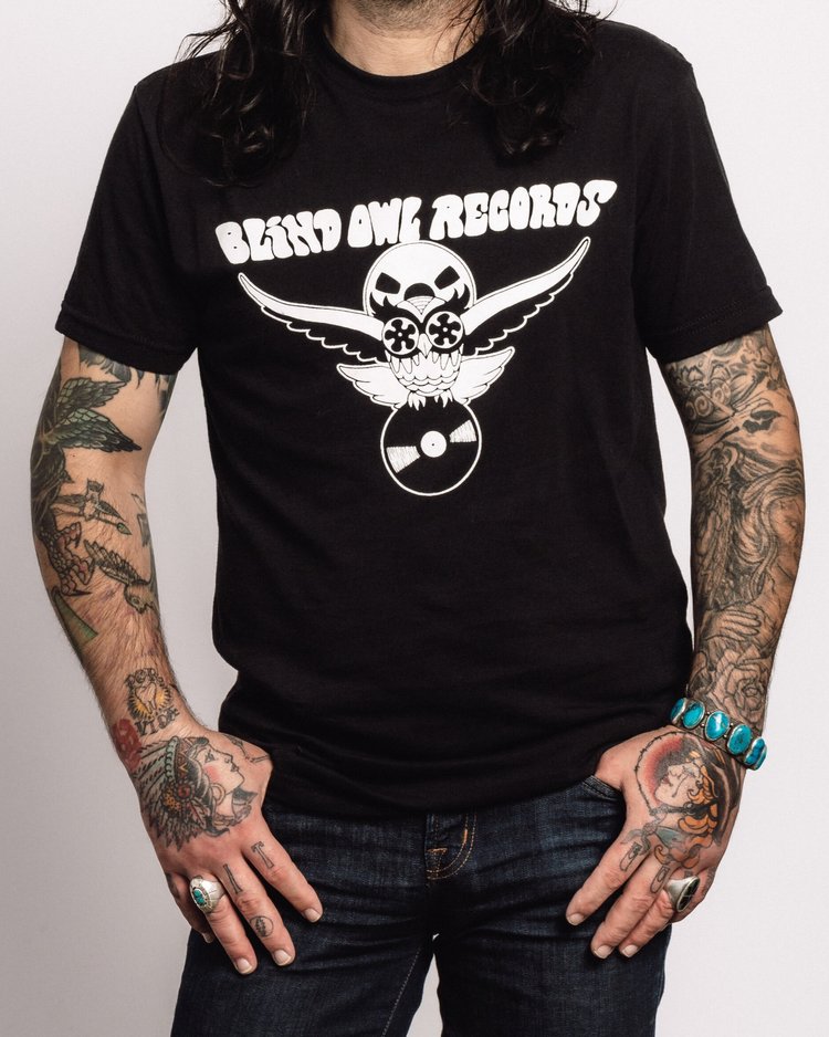 Blind Owl Records black t-shirt with owl logo artwork by Roy G Biv, front design